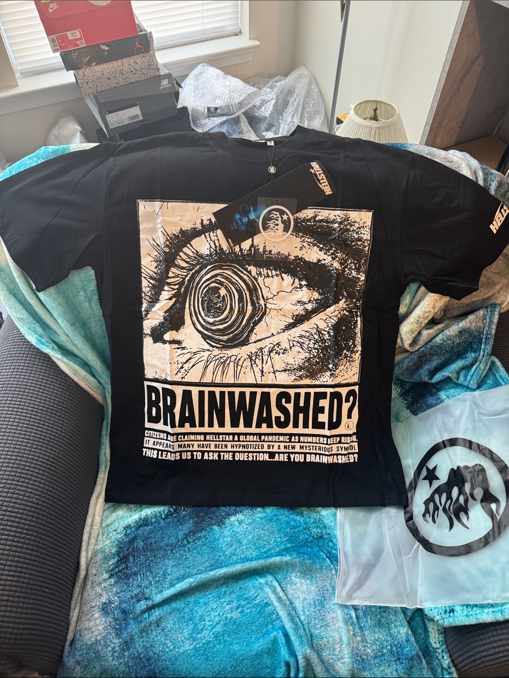 New! “Hellstar” Brainwashed T-shirt features a bold black and white eye graphic